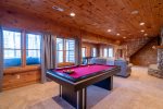 Lower Level Entertainment Area Features Sectional, Gas Fireplace, Flat Screen Tv, Pool Table and Shuffle Board